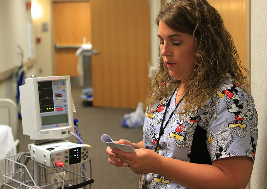 CNA working in a hospital environment